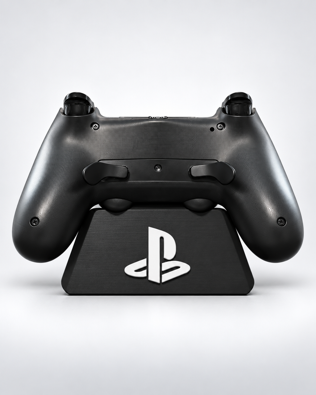 Installed DualSense Edge-style paddle mod on gunmetal grey and black Miseriboards PS4 controller, rear view