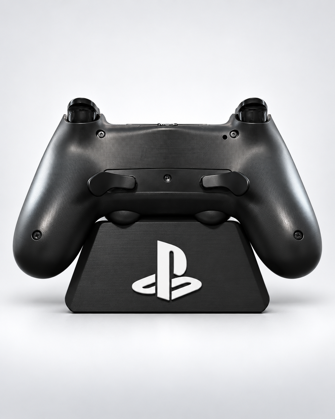 Installed DualSense Edge-style paddle mod on gunmetal grey and black Miseriboards PS4 controller, rear view